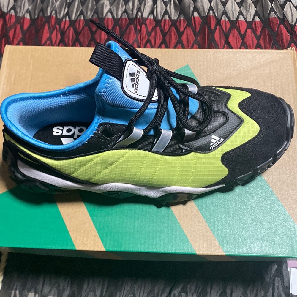 Never worn  lime green light blue black new in original condition and boxed